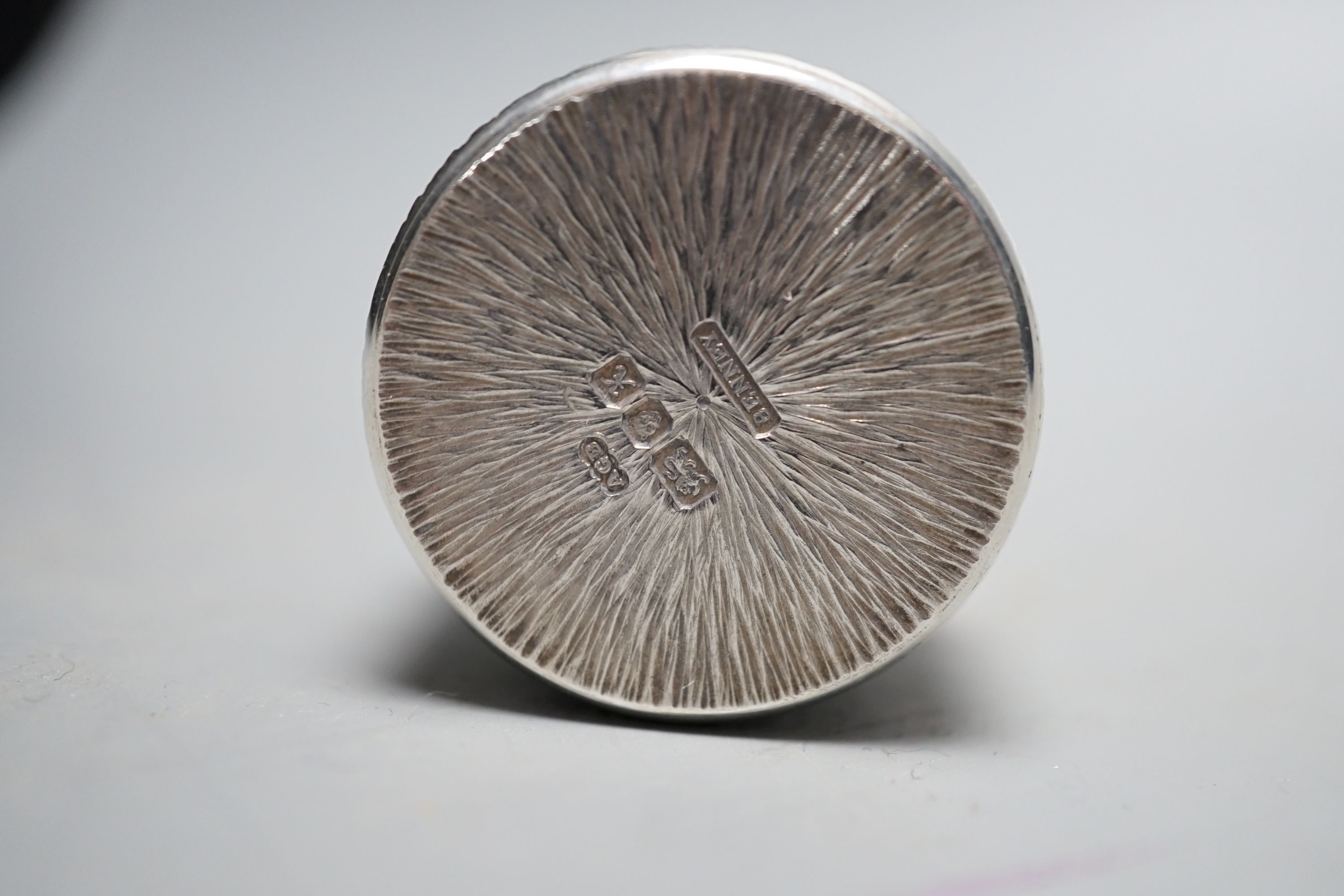 Adrian Gerald Benney- A modern textured silver pill box, engraved with the Prince of Wales feathers, London, 1997
